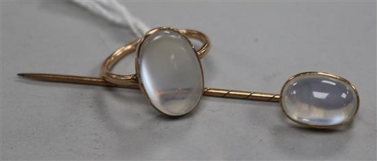 A yellow metal and moonstone ring and a similar stock pin, ring size O.